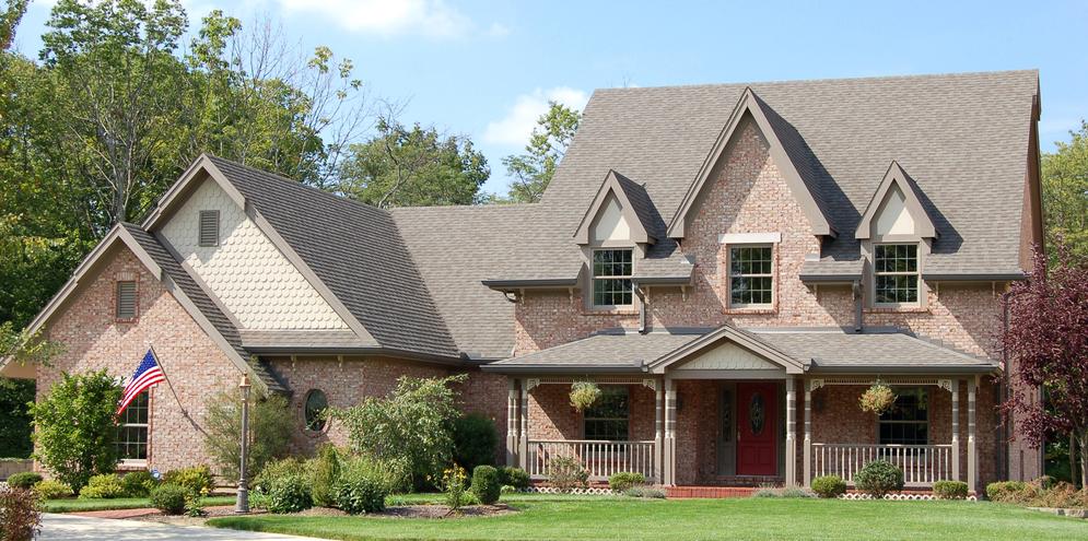 Brick home with landscaped front yard